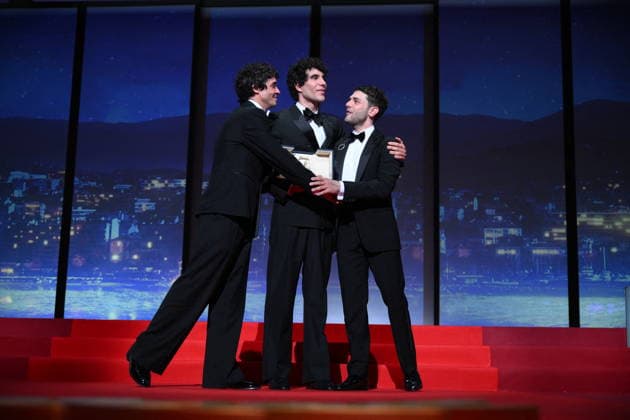 Cannes - Closing Ceremony Canadian filmmaker Xavier Dolan, Spanish director, screenwriter and producer Javier Ambrossi and Spanish director, screenwriter and producer Javier Calvo celebrate after winning the Best Director Prize for the film La Bola Negra during the closing ceremony of the 79th edition of the Cannes Film Festival in Cannes, France on May 23, 2026. Photo by Eliot Blondet ABACAPRESS.COM Cannes France  Copyright: xBlondetxEliot ABACAx
