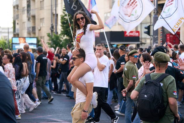 May 23, 2026, Belgrade, Central Serbia, Serbia: 2026523, Belgrade, Serbia - A large number of citizens answer the call of university students and gather to protest in the center of Belgrade. A female demonstrator sits on a man s shoulders during the protest. Belgrade Serbia  - ZUMAd223 20260523_zip_d223_004 Copyright: xMarkoxDimicx