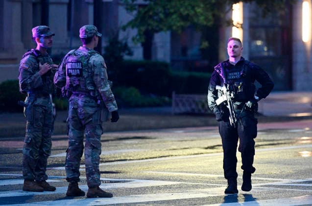 Multiple Shots Fired Half A Block From White House Complex Law enforcement, including members of the National Guard work the scene after multiple rapid-fire gunshots ring out outside the White House on May 23, 2026 in Washington, DC. A suspect was killed after opening fire on a Secret Service checkpoint outside the White House Saturday evening. Photo by Olivier Douliery ABACAPRESS.COM Washington DC United States  Copyright: xDoulieryxOlivier ABACAx