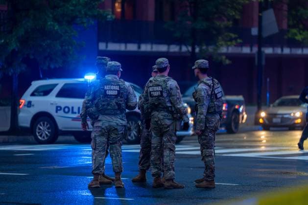 May 23, 2026, Washington, District Of Columbia, USA: National Guardsmen talk to each other as they stand near the scene of a shooting near the White House. Washington USA - ZUMAs365 20260523_znp_s365_009 Copyright: xJoeyxSussmanx