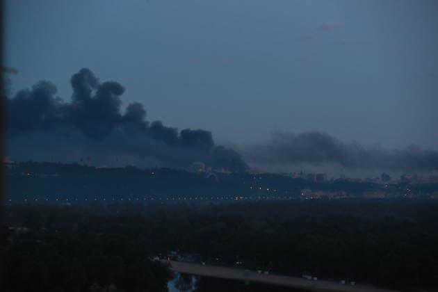 (260524) -- KIEV, May 24, 2026 -- Smoke rises in Kiev, Ukraine, May 24, 2026. A massive ballistic missile attack struck the Ukrainian capital early Sunday, said Tymur Tkachenko, head of the Kiev City Military Administration. A fire has been reported in the central Podilskyi district, Tkachenko wrote on Telegram, adding that at least three people were injured. The attack is ongoing and additional missile launches are possible, Tkachenko said. ) UKRAINE-KIEV-RUSSIA-MISSILE ATTACK LixDongxu 