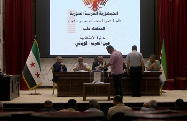 Syria holds parliamentary elections in Ain al-Arab ALEPPO GOVERNORATE, SYRIA - MAY 24: Voting begin to elect members of the country’s People’s Assembly (parliament), the Higher Committee for People’s Assembly Elections said in Ayn al-Arab district of Aleppo Governorate in northern Syria, on May 24, 2026. Polling opened in the Hasakah and Qamishli districts of Hasakah province, as well as in the Ain al-Arab district of Aleppo province, the SANA news agency said, citing the committee. The committee stated that 12 candidates are contesting two seats in Ain al-Arab from an electoral body of 100 members, while 13 candidates are competing for three seats in Hasakah, where 150 electors are eligible to vote. Bakr Al Kasem Anadolu Aleppo Syria. Ed  Copyright: x2026xAnadoluxBakrxAlxKasemx