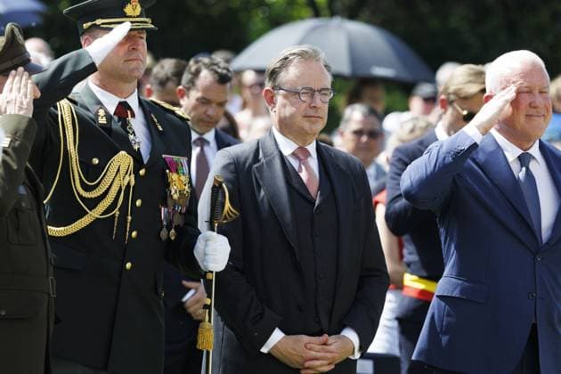 The representative of the King, Prime Minister Bart De Wever and US ambassador to Belgium Bill White pictured during the annual Memorial Day ceremony at the Flanders Field American Cemetery, in Waregem, Sunday 24 May 2026.  NICOLASxMAETERLINCK 174928955