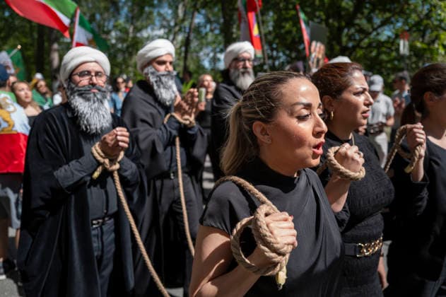 May 24, 2026, Stockholm, Sweden: Anti-Iranian regime protesters gather outside the Iranian Embassy in Stockholm, Sweden, on May 24, 2026, calling on Sweden to close the embassy and demanding restored internet access in Iran. Some demonstrators carried flags and signs in support of Reza Pahlavi. During the protest, participants staged a symbolic performance depicting imprisoned women confronting captured clerics, while chanting slogans against the Iranian regime and the ruling mullahs. Sweden - ZUMAa136 20260524_zap_a136_020 Copyright: xJoelxLindhex