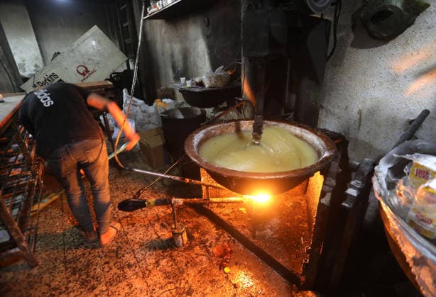 Palestinian workers produce traditional sweets ahead of Eid al-Adha Palestinian workers continued producing the traditional sweet known locally as Halakum at a factory in the Al-Daraj neighborhood, east of Gaza City, on May 24, 2026, ahead of Eid al-Adha. The factory resumed operations with limited resources after sustaining damage from Israeli airstrikes during the war. Halakum is a traditional sweet widely consumed during holidays, and the factory strives to provide it to residents despite the difficult living conditions and sharp decline in purchasing power in the Gaza Strip before Eid al-Adha. Photo by Bilal Osama apaimages Gaza city Gaza Strip Palestinian Territory 240526_Gaza_BO_01(1) Copyright: xapaimagesxBilalxOsamax xapaimagesx