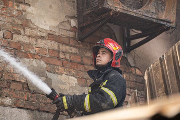 Ukraine Kyiv Shopping Centre Strike Aftermath A Ukrainian firefighter works with water hoses at the site of a heavily damaged shopping centre in Kyiv, Ukraine, on May 24, 2026, after Russian strikes. A large-scale Russian missile and drone attack hit Kyiv early on May 24 in what Moscow said was retaliation for strikes in Russian-occupied eastern Ukraine, with at least two people killed and more than 77 injured, including children. Kyiv Kyiv Ukraine Copyright: xOrixAviramx