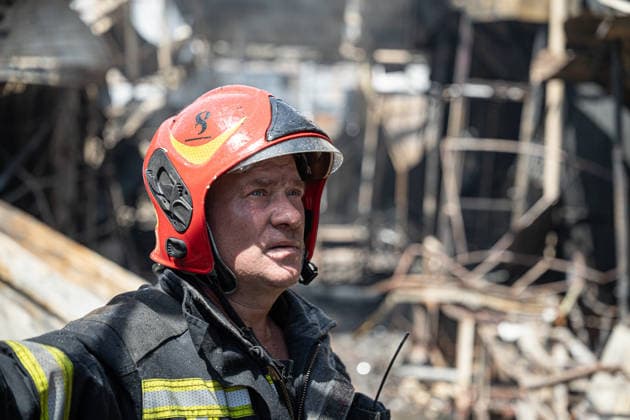 Ukraine Kyiv Shopping Centre Strike Aftermath A Ukrainian firefighter stands at the site of a heavily damaged shopping centre in Kyiv, Ukraine, on May 24, 2026, after Russian strikes. A large-scale Russian missile and drone attack hit Kyiv early on May 24 in what Moscow said was retaliation for strikes in Russian-occupied eastern Ukraine, with at least two people killed and more than 77 injured, including children. Kyiv Kyiv Ukraine Copyright: xOrixAviramx