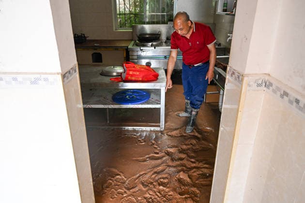 CHONGQING, CHINA - MAY 24: A large amount of mud silts up in a villager s house after extreme rainfalls trigger flash floods and geological disasters on May 24, 2026 in Yongchuan District, Chongqing City, China. Devastating rainstorms struck parts of Southwest China s Chongqing over the weekend, resulting in multiple casualties and missing people in the municipality s Yongchuan and Beibei districts. Rescue efforts are ongoing. As of 2:30 pm on May 24, local authorities reported three deaths and 17 people missing in Yongchuan, with another two people missing in Beibei.  Copyright: xChinaxNewsxServicex 111643812976