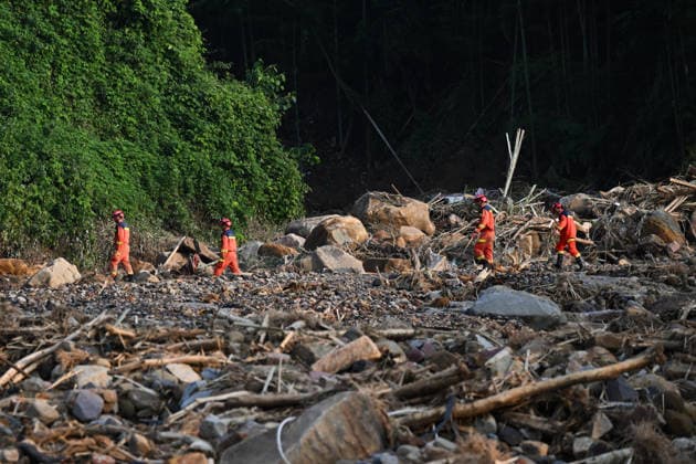 CHONGQING, CHINA - MAY 24: Rescue workers carry out search and rescue operations after extreme rainfalls trigger flash floods and geological disasters on May 24, 2026 in Yongchuan District, Chongqing City, China. Devastating rainstorms struck parts of Southwest China s Chongqing over the weekend, resulting in multiple casualties and missing people in the municipality s Yongchuan and Beibei districts. Rescue efforts are ongoing. As of 2:30 pm on May 24, local authorities reported three deaths and 17 people missing in Yongchuan, with another two people missing in Beibei.  Copyright: xChinaxNewsxServicex 111643846458