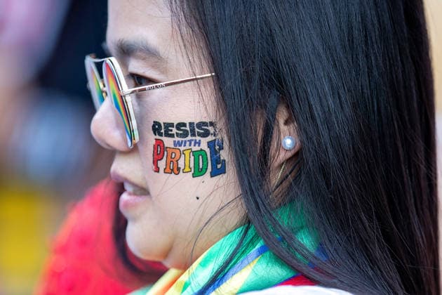 May 24, 2026, Chiang Mai, Thailand: A participant with a Ã¬Resist with Pridei face sticker attends The Chiang Mai Pride Parade 2026 celebrations. The Chiang Mai Pride Parade 2026 took place in Chiang Mai, Thailand. Chiang Mai province holds Thailandis first Pride Month celebrations annually, promoting gender equality, diversity, and human rights as part of Pride Month activities in northern Thailand. Chiang Mai Thailand - ZUMAs197 20260524_aaa_s197_118 Copyright: xPongmanatxTasirix