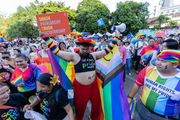 May 24, 2026, Chiang Mai, Thailand: A participant holds a placard and a megaphone while joining The Chiang Mai Pride Parade 2026 celebrations. The Chiang Mai Pride Parade 2026 took place in Chiang Mai, Thailand. Chiang Mai province holds Thailandis first Pride Month celebrations annually, promoting gender equality, diversity, and human rights as part of Pride Month activities in northern Thailand. Chiang Mai Thailand  - ZUMAs197 20260524_aaa_s197_144 Copyright: xPongmanatxTasirix