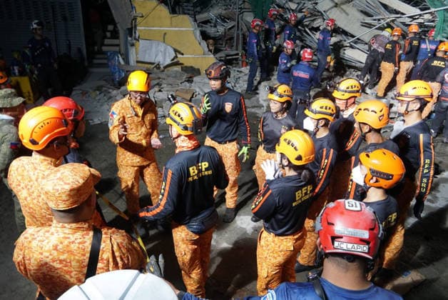 (260525) -- MANILA, May 25, 2026 -- Rescuers search for survivors at the site of a collapsed building in Angeles City, Pampanga province, the Philippines, May 24, 2026. Four people were confirmed dead after a building collapsed before dawn Sunday in Angeles City in northern Philippines Pampanga province, as search and rescue operations continue for 17 missing people, authorities said Monday. ( Handout via Xinhua) (SpotNews) PHILIPPINES-PAMPANGA-ANGELES-BUILDING COLLAPSE BureauxofxFirexProtectionxCentralxLuzon 
