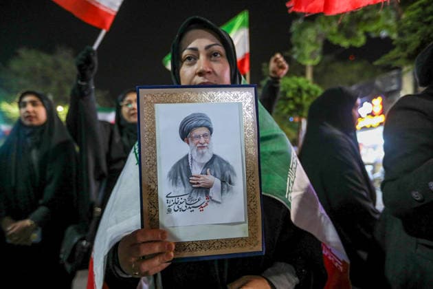 May 25, 2026, Iran, Iran: Pro-government supporters wave national flags during a state-organized rally, amid a ceasefire with Iran, the US, and Israel. President Donald Trump issued a fresh warning to Iran on May 17, saying it had to move quickly towards a peace deal or there won t be anything left of them. Washington, locked in conflict with Tehran since US and Israeli forces launched major strikes on the Islamic Republic beginning February 28, has struggled to break an impasse and make any progress toward ending a war that has shaken the Middle East and sent energy prices climbing. Iran s foreign ministry said on May 25, that Tehran was collecting fees for navigational services on ships transiting the strategic Strait of Hormuz, r - ZUMAi98_ 20260525_zih_i98_010 Copyright: xIranianxSupremexLeader SxOfficex