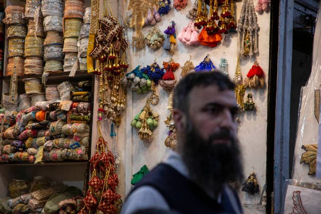 May 25, 2026, Srinagar, Jammu And Kashmir, India: A vendor is sitting in his shop at a market where people are shopping ahead of Eid al-Adha, also known as the Festival of Sacrifice, in Srinagar. Eid al-Adha is the second major Islamic festival of the year. Eid ul-Adha ( Festival of Sacrifice ) is one of the most important festivals in the Muslim calendar. The festival commemorates Prophet Ibrahim s willingness to sacrifice his son in obedience to God s command. Srinagar India - ZUMAa205 20260525_zip_a205_010 Copyright: xAdilxAbassx
