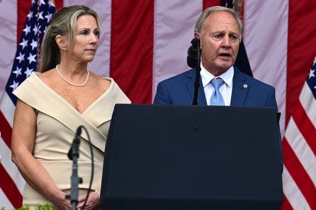 Gold Star Family members Karen Vaughn and Bill Vaughn make remarks prior to United States President Donald J Trump delivering remarks in the Amphitheater after laying a wreath at the Tomb of the Unknowns at Arlington National Cemetery in Arlington, Virginia on Memorial Day, Monday, May 25, 2026..  WAX20260525223 KylexMazza