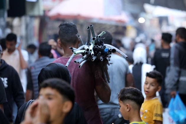 Palestinians walk through Gaza City market ahead of Eid al-Adha Palestinians walk through Omar al-Mukhtar market in Gaza City on May 25, 2026, ahead of Eid al-Adha, as vendors display goods on temporary roadside stalls. The market witnessed weak consumer demand and declining purchasing power amid worsening economic conditions caused by the ongoing war. Photo by Bilal Osama apaimages Gaza city Gaza Strip Palestinian Territory 250526_Gaza_BO_01(36) Copyright: xapaimagesxBilalxOsamax xapaimagesx