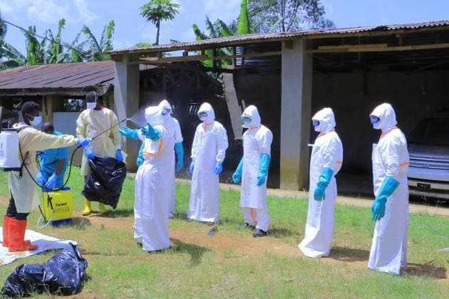 Ebola outbreak in Democratic Republic of Congo MONGBWALU, DEMOCRATIC REPUBLIC OF THE CONGO - MAY 25: Health workers wearing protective equipment carry out disinfection procedures in the area following the death of a person with suspected Ebola infection in Mongbwalu village of Ituri province in eastern Democratic Republic of the Congo, on May 25, 2026. Marcus Loika Anadolu Mongbwalu Democratic Republic of the Congo. Editorial use only. Please get in touch for any other usage.  Copyright: x2026xAnadoluxMarcusxLoikax