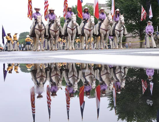 May 25, 2026, Washington, District Of Columbia, USA: Members of the Six White Horses team from Hardin-Simmons University take part in the National Memorial Day Parade on Constitution Avenue in Washington, DC, USA, on May 25, 2026. The parade has been held annually since 2005, marking its 21st anniversary. Washington USA  - ZUMAs337 20260525_znp_s337_034 Copyright: xGentxShkullakux