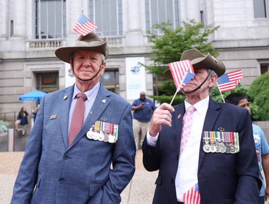 May 25, 2026, Washington, District Of Columbia, USA: Veterans with American flags watch the National Memorial Day Parade in Washington, DC, USA, on May 25, 2026. The parade has been held annually since 2005, marking its 21st anniversary. Washington USA  - ZUMAs337 20260525_znp_s337_031 Copyright: xGentxShkullakux