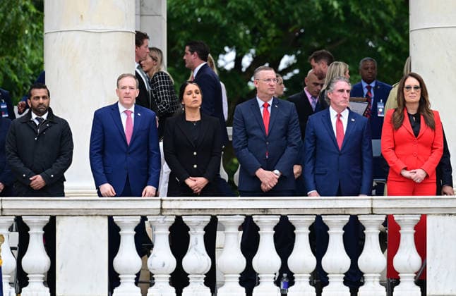 May 25, 2026, Arlington, Virginia, USA: Members of the Cabinet look on as United States President Donald J Trump delivers remarks in the Amphitheater after laying a wreath at the Tomb of the Unknowns at Arlington National Cemetery in Arlington, Virginia on Memorial Day, Monday, May 25, 2026. From left to right: Kash Patel, Director, Federal Bureau of Investigation (FBI); Lee Zeldin, Director, US Environmental Protection Agency (EPA); Tulsi Gabbard, Director of National Intelligence (DNI); US Secretary of Veterans Affairs Doug Collins; US Secretary of the Interior and Chair, National Energy Council and White House Energy Czar Doug Burgum; and US Secretary of Agriculture Brooke Rollins Arlington USA  - ZUMAs152 20260525_faa_s152_041 Copyright: xKylexMazzax-xPoolxviaxCNPx