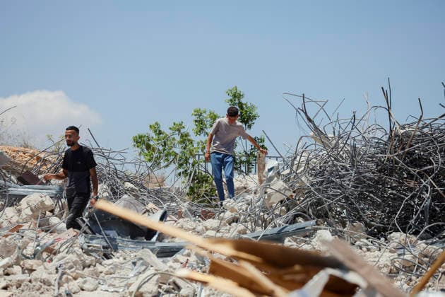 Israeli Demolition West Bank Family Displaced Eid Al-Adha Two men walk across the rubble of a destroyed building in Nahhalin, occupied West Bank, on May 25, 2026. The demolition, carried out by Israeli forces who stated the structure was built without a permit, displaced an eight-member Palestinian family just two days before the Islamic holiday of Eid al-Adha. Bethlehem West Bank Palestinian Territories Copyright: xMosabxShawerx
