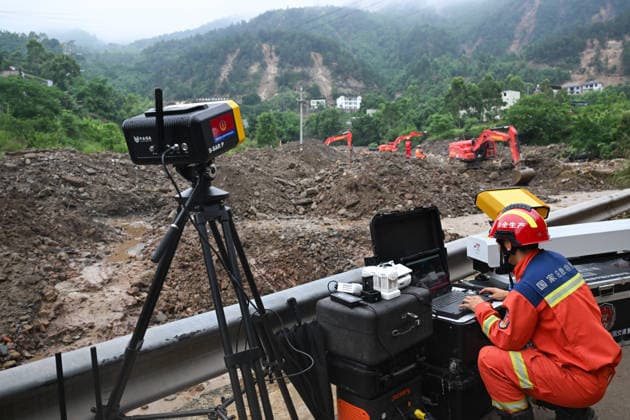 CHONGQING, CHINA - MAY 25: Rescuer uses slope radar to monitor mountain stability at the disaster-hit area after a heavy rainstorm hit Yongchuan District on May 25, 2026 in Chongqing, China. Record-breaking torrential rain battered Yongchuan District in southwest China s Chongqing Municipality from late May 23 to May 24, triggering flash floods, landslides and mudslides. Rescue operations are still underway as multiple towns and subdistricts suffered severe damage.  Copyright: xChinaxNewsxServicex 111643996223