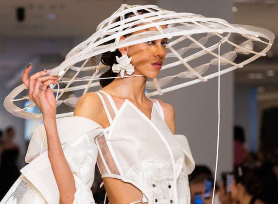 (260526) -- TORONTO, May 26, 2026 -- A model presents a creation at the Fashion Art Toronto s Fashion Week Spring Summer 2026 in Toronto, Canada, on May 25, 2026. The annual event kicked off here on Monday and will last until May 31. (Photo by Xinhua) CANADA-TORONTO-FASHION WEEK-OPENING ZouxZheng 