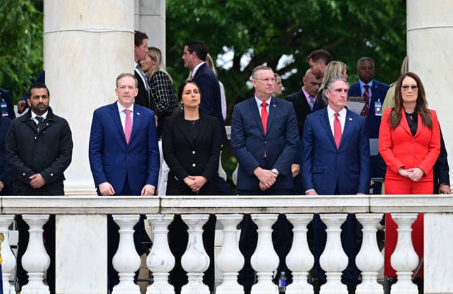 Trump Remarks on Memorial Day at Arlington National Cemetery Members of the Cabinet look on as United States President Donald J Trump delivers remarks in the Amphitheater after laying a wreath at the Tomb of the Unknowns at Arlington National Cemetery in Arlington, Virginia on Memorial Day, Monday, May 25, 2026. From left to right: Kash Patel, Director, Federal Bureau of Investigation (FBI); Lee Zeldin, Director, US Environmental Protection Agency (EPA); Tulsi Gabbard, Director of National Intelligence (DNI); US Secretary of Veterans Affairs Doug Collins; US Secretary of the Interior and Chair, National Energy Council and White House Energy Czar Doug Burgum; and US Secretary of Agriculture Brooke Rollins. Credit: CNP AdMedia Arlington V  Copyright: xx AdMediax admphotostwo992186
