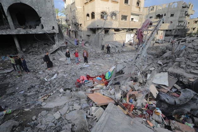 Palestinians inspect damage after Israeli strike in Nuseirat camp Palestinians inspect damage to their homes following an Israeli strike that targeted a house belonging to the al-Tawil family in the Nuseirat refugee camp in the central Gaza Strip on May 25, 2026. The strike destroyed the house completely and caused severe damage to neighboring homes. According to Palestinian medical sources, four Palestinians were wounded in the attack, which came after residents were warned to evacuate the area the previous night. Photo by Hassan al-Jedi apaimages Nusairat Gaza Strip Palestinian Territory 260526_Nuseirat_HJ_00(25).jpeg Copyright: xapaimagesxHassanxal-Jedixx xapaimagesx
