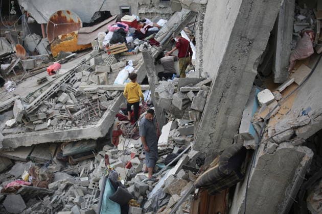 Palestinians inspect damage after Israeli strike in Nuseirat camp Palestinians inspect damage to their homes following an Israeli strike that targeted a house belonging to the al-Tawil family in the Nuseirat refugee camp in the central Gaza Strip on May 25, 2026. The strike destroyed the house completely and caused severe damage to neighboring homes. According to Palestinian medical sources, four Palestinians were wounded in the attack, which came after residents were warned to evacuate the area the previous night. Photo by Hassan al-Jedi apaimages Nusairat Gaza Strip Palestinian Territory 260526_Nuseirat_HJ_00(42).jpeg Copyright: xapaimagesxHassanxal-Jedixx xapaimagesx