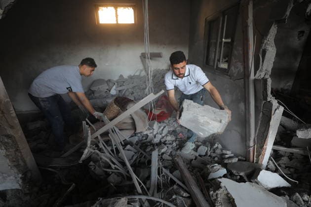 Palestinians inspect damage after Israeli strike in Nuseirat camp Palestinians inspect damage to their homes following an Israeli strike that targeted a house belonging to the al-Tawil family in the Nuseirat refugee camp in the central Gaza Strip on May 25, 2026. The strike destroyed the house completely and caused severe damage to neighboring homes. According to Palestinian medical sources, four Palestinians were wounded in the attack, which came after residents were warned to evacuate the area the previous night. Photo by Hassan al-Jedi apaimages Nusairat Gaza Strip Palestinian Territory 260526_Nuseirat_HJ_00(14).jpeg Copyright: xapaimagesxHassanxal-Jedixx xapaimagesx