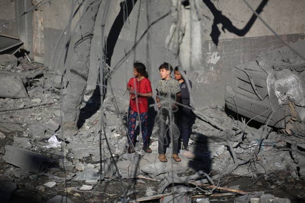Palestinians inspect damage after Israeli strike in Nuseirat camp Palestinians inspect damage to their homes following an Israeli strike that targeted a house belonging to the al-Tawil family in the Nuseirat refugee camp in the central Gaza Strip on May 25, 2026. The strike destroyed the house completely and caused severe damage to neighboring homes. According to Palestinian medical sources, four Palestinians were wounded in the attack, which came after residents were warned to evacuate the area the previous night. Photo by Hassan al-Jedi apaimages Nusairat Gaza Strip Palestinian Territory 260526_Nuseirat_HJ_00(28).jpeg Copyright: xapaimagesxHassanxal-Jedixx xapaimagesx