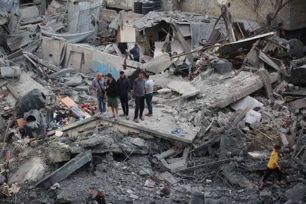 Palestinians inspect damage after Israeli strike in Nuseirat camp Palestinians inspect damage to their homes following an Israeli strike that targeted a house belonging to the al-Tawil family in the Nuseirat refugee camp in the central Gaza Strip on May 25, 2026. The strike destroyed the house completely and caused severe damage to neighboring homes. According to Palestinian medical sources, four Palestinians were wounded in the attack, which came after residents were warned to evacuate the area the previous night. Photo by Hassan al-Jedi apaimages Nusairat Gaza Strip Palestinian Territory 260526_Nuseirat_HJ_00(47).jpeg Copyright: xapaimagesxHassanxal-Jedixx xapaimagesx