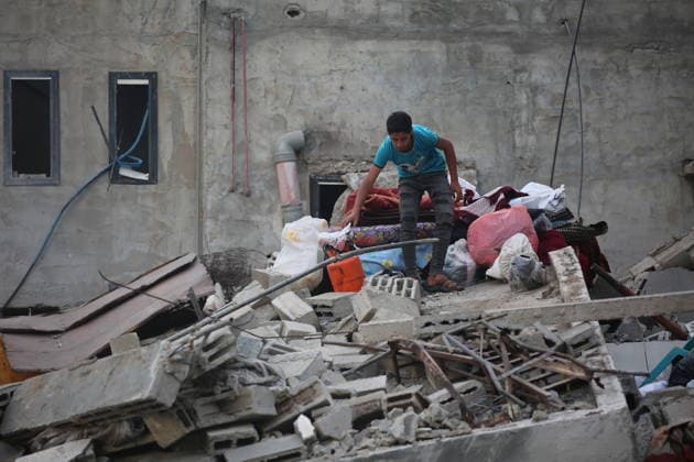 Palestinians inspect damage after Israeli strike in Nuseirat camp Palestinians inspect damage to their homes following an Israeli strike that targeted a house belonging to the al-Tawil family in the Nuseirat refugee camp in the central Gaza Strip on May 25, 2026. The strike destroyed the house completely and caused severe damage to neighboring homes. According to Palestinian medical sources, four Palestinians were wounded in the attack, which came after residents were warned to evacuate the area the previous night. Photo by Hassan al-Jedi apaimages Nusairat Gaza Strip Palestinian Territory 260526_Nuseirat_HJ_00(48).jpeg Copyright: xapaimagesxHassanxal-Jedixx xapaimagesx