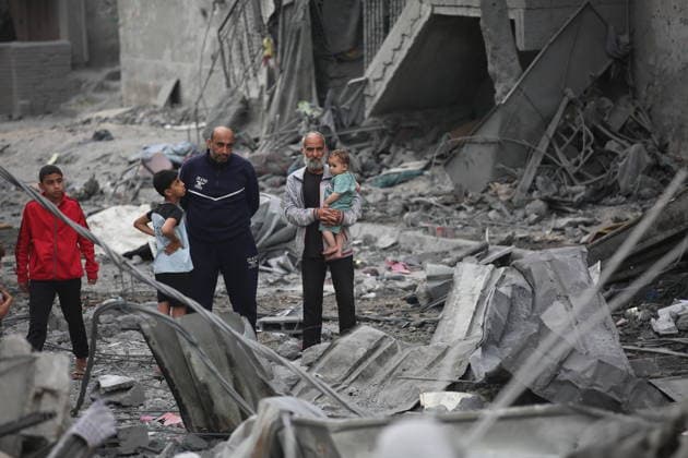 Palestinians inspect damage after Israeli strike in Nuseirat camp Palestinians inspect damage to their homes following an Israeli strike that targeted a house belonging to the al-Tawil family in the Nuseirat refugee camp in the central Gaza Strip on May 25, 2026. The strike destroyed the house completely and caused severe damage to neighboring homes. According to Palestinian medical sources, four Palestinians were wounded in the attack, which came after residents were warned to evacuate the area the previous night. Photo by Hassan al-Jedi apaimages Nusairat Gaza Strip Palestinian Territory 260526_Nuseirat_HJ_00(50).jpeg Copyright: xapaimagesxHassanxal-Jedixx xapaimagesx