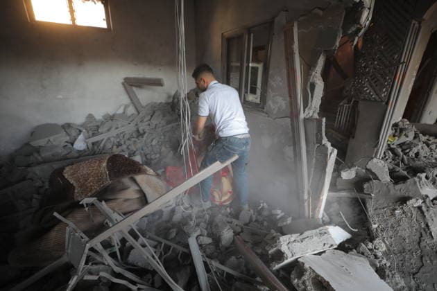 Palestinians inspect damage after Israeli strike in Nuseirat camp Palestinians inspect damage to their homes following an Israeli strike that targeted a house belonging to the al-Tawil family in the Nuseirat refugee camp in the central Gaza Strip on May 25, 2026. The strike destroyed the house completely and caused severe damage to neighboring homes. According to Palestinian medical sources, four Palestinians were wounded in the attack, which came after residents were warned to evacuate the area the previous night. Photo by Hassan al-Jedi apaimages Nusairat Gaza Strip Palestinian Territory 260526_Nuseirat_HJ_00(9).jpeg Copyright: xapaimagesxHassanxal-Jedixx xapaimagesx