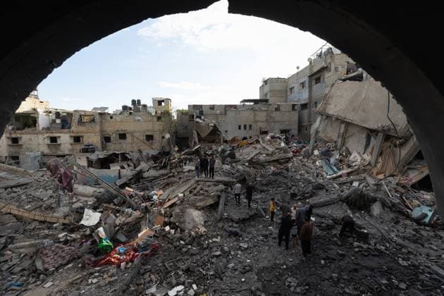 Israeli army bombed a building in Nuseirat NUSEIRAT, GAZA, PALESTINE - MAY 26: Local residents inspect the destroyed building and the damaged houses following the Israeli strike on a building belonging to the Tawil family in the Nuseirat Refugee Camp in Gaza, Palestine on May 26, 2026. The building was completely destroyed in the attack, while nearby homes were also damaged. Residents went through the rubble to find their belongings. Mahmoud Abu Hamda Anadolu Nuseirat Gaza. Editorial use only. Please get in touch for any other usage.  Copyright: x2026xAnadoluxMahmoudxAbuxHamdax