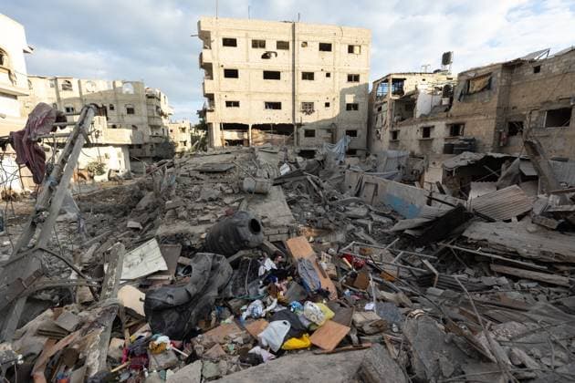 Israeli army bombed a building in Nuseirat NUSEIRAT, GAZA, PALESTINE - MAY 26: Local residents inspect the destroyed building and the damaged houses following the Israeli strike on a building belonging to the Tawil family in the Nuseirat Refugee Camp in Gaza, Palestine on May 26, 2026. The building was completely destroyed in the attack, while nearby homes were also damaged. Residents went through the rubble to find their belongings. Mahmoud Abu Hamda Anadolu Nuseirat Gaza. Editorial use only. Please get in touch for any other usage.  Copyright: x2026xAnadoluxMahmoudxAbuxHamdax