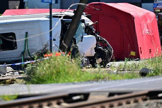 the scene of an accident between a train and a minivan, at the railway crossing Vierhuizen, in Buggenhout, Tuesday 26 May 2026. The accident happened around 8:15 am. Several people have been killed. According to initial reports, the level crossing was closed at the time of the accident.  DIRKxWAEM 175090603