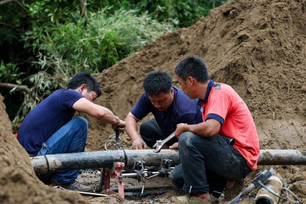 (260526) -- CHONGQING, May 26, 2026 -- Staff members repair tap water pipes at Yongchuan District of southwest China s Chongqing Municipality, May 26, 2026. From Saturday night to early Sunday morning, a sudden and extreme catastrophic rainstorm struck Yongchuan, triggering flash floods and geological disasters in multiple areas of this district. After the disaster occurred, the local authorities immediately activated the emergency response mechanism, coordinated rescue forces from all sides and made every effort to carry out rescue operations and infrastructure restoration. Rescue and response efforts are still underway. ) CHINA-CHONGQING-FLOOD-RESCUE (CN) HuangxWei 