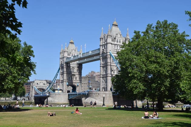 May 26, 2026, London, England, United Kingdom: A handful of people sunbathe in the scorching sun in Potters Fields Park next to Tower Bridge while most sit in the shade as temperatures soar in the capital. The UK recorded its hottest ever day in May yesterday. London United Kingdom - ZUMAv130 20260526_zip_v130_010 Copyright: xVukxValcicx
