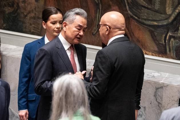 May 26, 2026, New York, New York, USA: Wang Yi, Member of the Political Bureau of the CPC Central Committee and Minister for Foreign Affairs of China speaks with Abdullatif bin Rashid Al Zayani, Minister for Foreign Affairs of Bahrain before the Security Council meeting on Upholding the purposes and principles of the UN Charter and strengthening the UN-centered international system at UN Headquarters in New York, NY on May 26, 2026. China organized this meeting as it is a President of Security Council for the month of May. New York USA - ZUMAr339 20260526_znp_r339_013 Copyright: xLevxRadinx