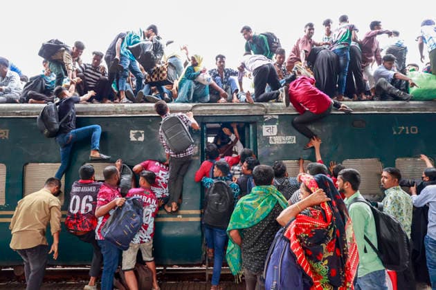May 26, 2026, Tongi, Bangladesh: Bangladeshi Muslim passengers struggle to board an overcrowded train as they travel home ahead of the upcoming Eid al-Adha festival at a railway station in Tongi, near Dhaka, Bangladesh, Monday, May 26, 2024. Millions of people are expected to leave the capital in one of the countryÃ¢â‚¬â ¢s largest annual holiday exoduses to celebrate Eid with their families in rural areas. Tongi Bangladesh  - ZUMAd117 20260526_fap_d117_045 Copyright: xSuvraxKantixDasx