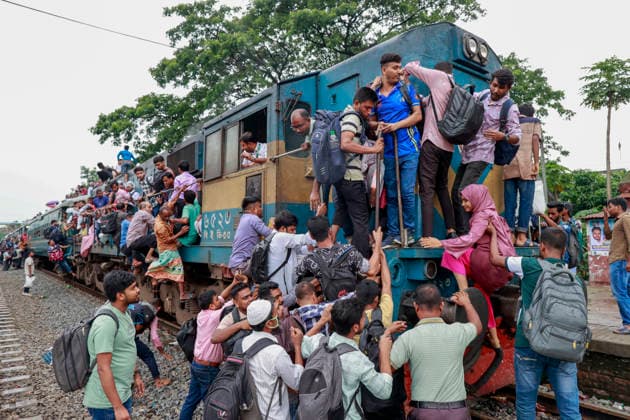May 26, 2026, Tongi, Bangladesh: Bangladeshi Muslim passengers struggle to board an overcrowded train as they travel home ahead of the upcoming Eid al-Adha festival at a railway station in Tongi, near Dhaka, Bangladesh, Monday, May 26, 2024. Millions of people are expected to leave the capital in one of the countryÃ¢â‚¬â ¢s largest annual holiday exoduses to celebrate Eid with their families in rural areas. Tongi Bangladesh - ZUMAd117 20260526_fap_d117_013 Copyright: xSuvraxKantixDasx