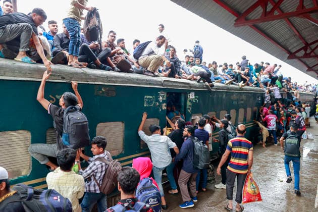 May 26, 2026, Tongi, Bangladesh: Bangladeshi Muslim passengers struggle to board an overcrowded train as they travel home ahead of the upcoming Eid al-Adha festival at a railway station in Tongi, near Dhaka, Bangladesh, Monday, May 26, 2024. Millions of people are expected to leave the capital in one of the countryÃ¢â‚¬â ¢s largest annual holiday exoduses to celebrate Eid with their families in rural areas. Tongi Bangladesh  - ZUMAd117 20260526_fap_d117_041 Copyright: xSuvraxKantixDasx