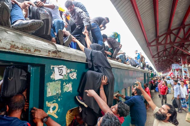May 26, 2026, Tongi, Bangladesh: Bangladeshi Muslim passengers struggle to board an overcrowded train as they travel home ahead of the upcoming Eid al-Adha festival at a railway station in Tongi, near Dhaka, Bangladesh, Monday, May 26, 2024. Millions of people are expected to leave the capital in one of the countryÃ¢â‚¬â ¢s largest annual holiday exoduses to celebrate Eid with their families in rural areas. Tongi Bangladesh  - ZUMAd117 20260526_fap_d117_042 Copyright: xSuvraxKantixDasx