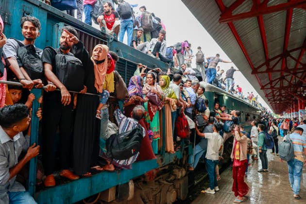 May 26, 2026, Tongi, Bangladesh: Bangladeshi Muslim passengers struggle to board an overcrowded train as they travel home ahead of the upcoming Eid al-Adha festival at a railway station in Tongi, near Dhaka, Bangladesh, Monday, May 26, 2024. Millions of people are expected to leave the capital in one of the countryÃ¢â‚¬â ¢s largest annual holiday exoduses to celebrate Eid with their families in rural areas. Tongi Bangladesh - ZUMAd117 20260526_fap_d117_030 Copyright: xSuvraxKantixDasx