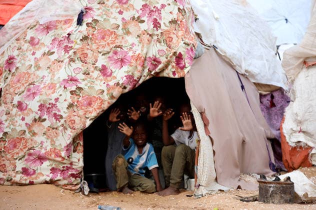Camps turn into permanent settlements amid ongoing crisis in Somalia MOGADISHU, SOMALIA - MAY 26: Children wave form a tent as millions of people living in camps that have gradually turned into permanent settlements, where they continue to face difficult living conditions amid insecurity, conflict and drought in the capital Mogadishu, Somalia, on May 26, 2026. Metin Yuksel Kaya Anadolu Mogadishu Somalia. Editorial use only. Please get in touch for any other usage.  Copyright: x2026xAnadoluxMetinxYukselxKayax