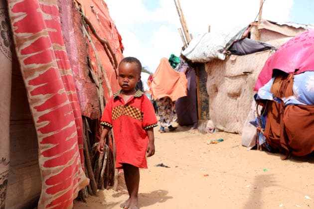 Camps turn into permanent settlements amid ongoing crisis in Somalia MOGADISHU, SOMALIA - MAY 26: A boy walks among tents as millions of people living in camps that have gradually turned into permanent settlements, where they continue to face difficult living conditions amid insecurity, conflict and drought in the capital Mogadishu, Somalia, on May 26, 2026. Metin Yuksel Kaya Anadolu Mogadishu Somalia. Editorial use only. Please get in touch for any other usage.  Copyright: x2026xAnadoluxMetinxYukselxKayax