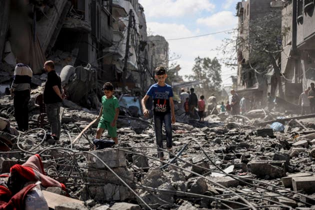 Nuseirat Homes Destroyed Airstrike Palestinian children walk through debris following an Israeli strike in Nuseirat in the central Gaza Strip on May 26, 2026. The strike came amid the ongoing war between Israel and Hamas, which has devastated large parts of the Gaza Strip and displaced much of its population. Nuseirat Gaza Strip Palestinian Territories Copyright: xAhmedxYounisx